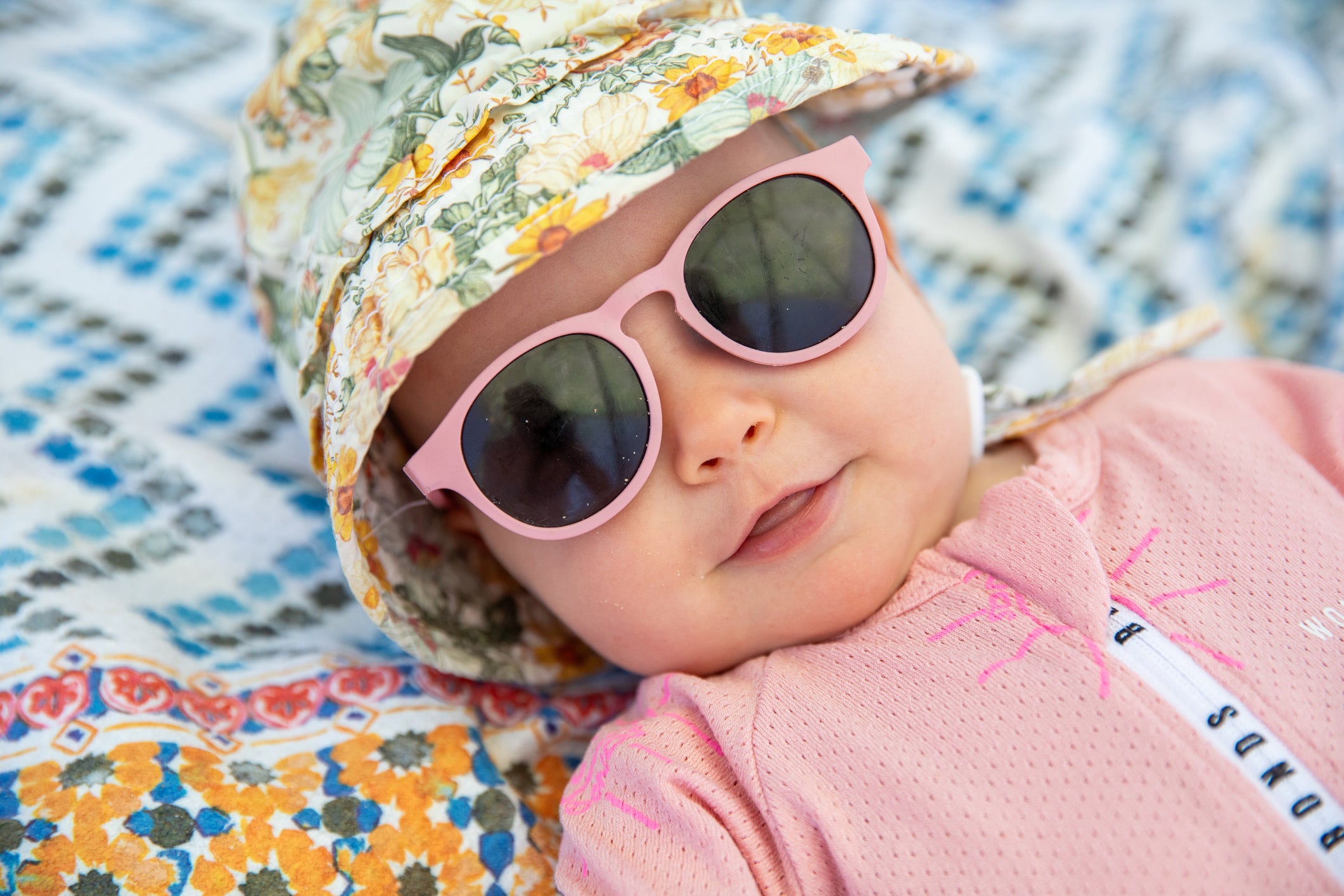 baby in hat and sunglasses